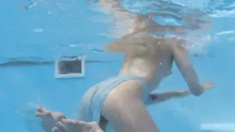 Finnish blonde inked pornstar Mimi underwater