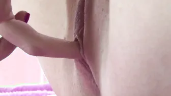 Little Kylie rubs and fingers her pussy until orgasm