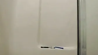 Redhead girl is getting hot and horny in a shower bathroom