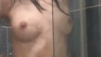 Teen Lesley takes a hot shower to make her more horny