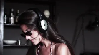 Cutie Spanish DJ fingering her bushy cunt to an extreme orgasm