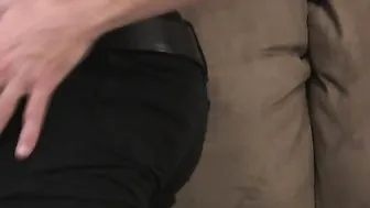 Tattooed dude with long dreads and Prince Albert piercing strokes himself in apartment.