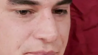 Young twenty something with buz cut plays with himself on couch.