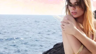 Naked Spanish babe posing on the rocks