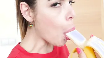 Cute girl eats a banana and fingers herself