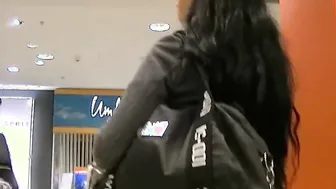 Kinky black haired teen secretly gives a blowjob in a changing room