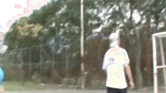 Paris Milan plays basketball outdoors