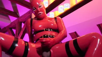 Shemale in Red Latex is Ready to Dominate You with Her Hard Cock