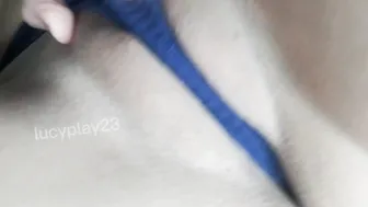 Sexual and playful young woman masturbating with the g-string she is wearing