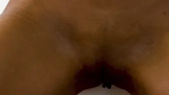 Sultry ebony babe reveals her dark pussy