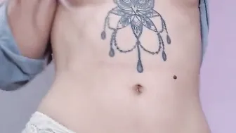 Hot Tattooed Babe having fun playing with her Pussy