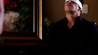 Bruce Venture has given himself over to his womans ample charms allowing himself to be blindfolded and bound up by