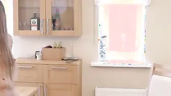 Devina is just amazing as the housewife gets naked inside the kitchen. Her african bra and g-string and matching thigh high