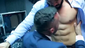 Elegant hunk wears slick blue suit while ramming hot stud