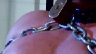Man with muscles cant scream while being heavily chained