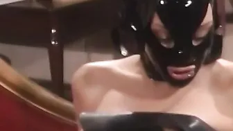 Latex mistress torments masked lesbian submissive