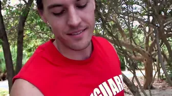 Muscled lifeguard ass stretched at the beach