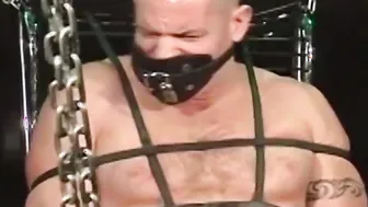 Inked man is tied up and humiliated as he is in underwear