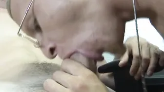 Young office man provided with blowjob by gay coworker