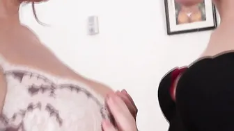 Old and young lesbian couple playing together