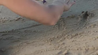 Exotic cutie Natalia playing on a sandy beach