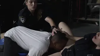 Busty officers take on a black monster cock in storage room