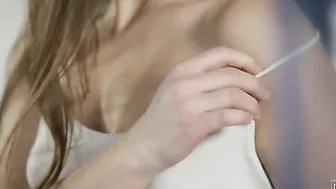 Running her hands all over her silky smooth skin Xenia prepares her body for the