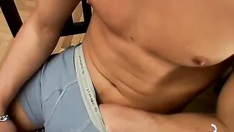 Buffed Keith displays body and uncut penis while sitting