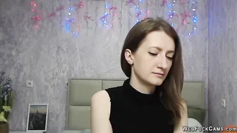 Brunette amateur with naked shoulders on webcam