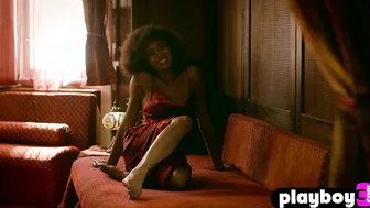 Curly ebony model shows perfect body